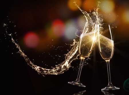 49294033 – glasses of champagne with splash, isolated on black