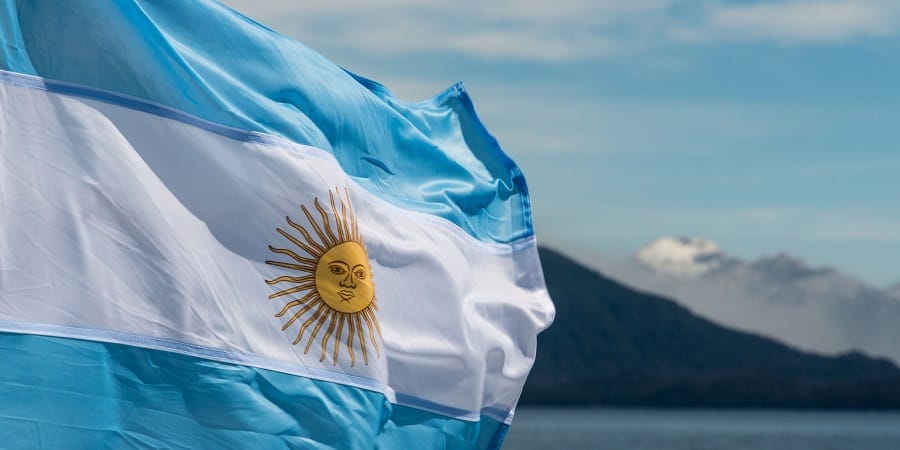 51097597 – argentina flag with mountains in background