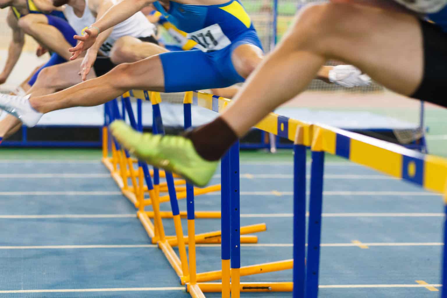 73579059 – sportsmen running hurdles sprint race