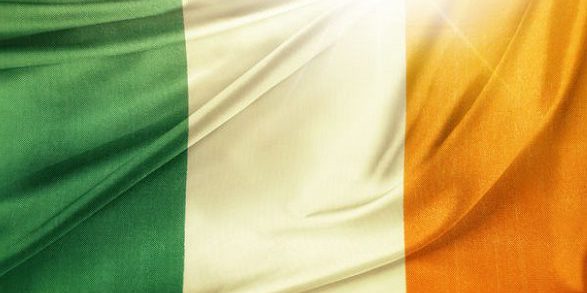 43999330 – irish flag in front of bright sky