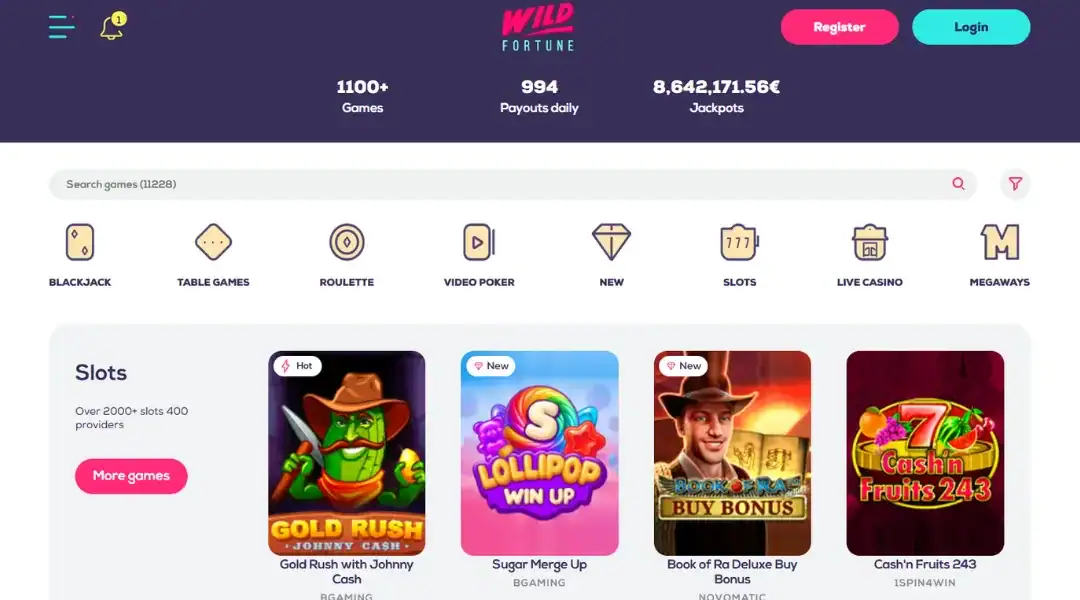 Wild Fortune casino lobby with search bar, game categories, jackpot stats, and featured slot games.