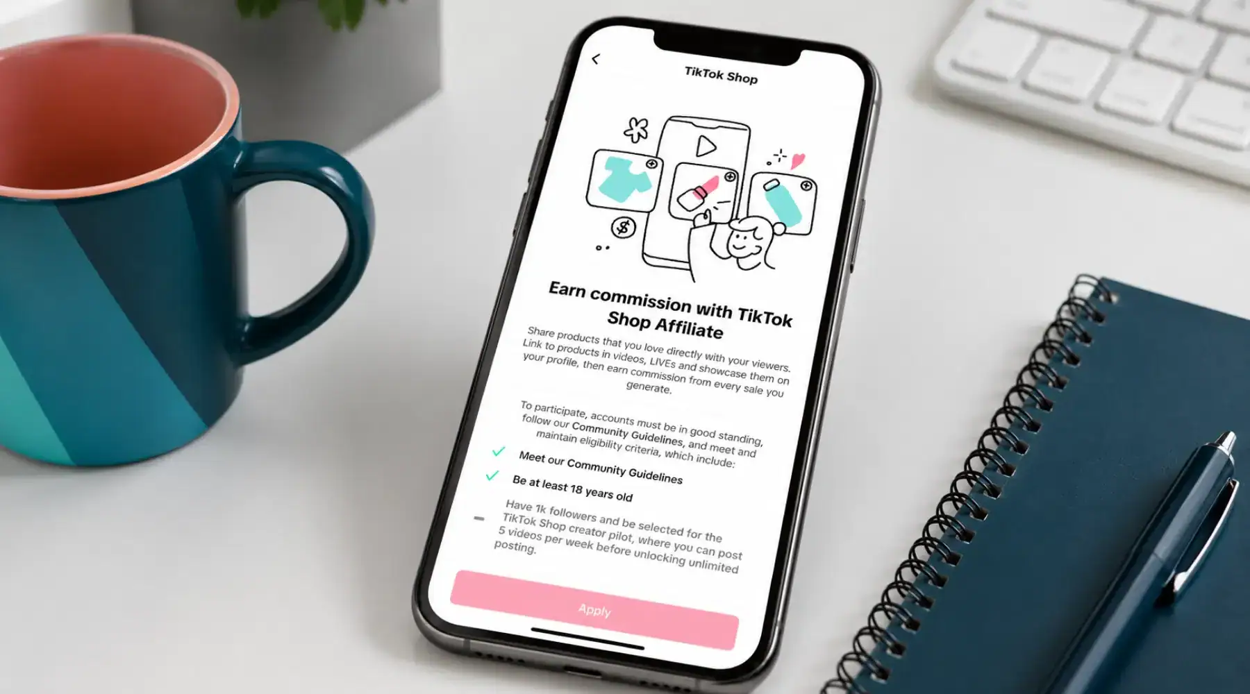 Image displaying a phone on a desk with the TikTok Shop Affiliate on the screen.