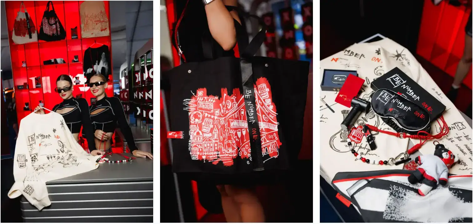 Fashion display featuring black, white, and red illustrated apparel, tote bags, accessories, and two models.